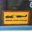 For Helicopters ONLY! This picture was taken in Iceland. The sign says, for helicopters only, and according to the sign airplanes will be towed away presumably at owners expense.
