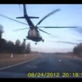 Russian Mi-8 Helicopter Flying Over A Highway