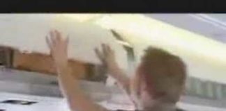 How to close aircraft overhead compartment