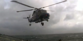 Lynx Helicopter Landing On Ship In Rough Sea
