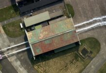Low side-by-side pass through a hangar