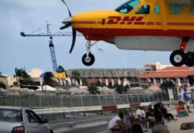 DHL Pilot Makes Some LOW Approaches Over Maho Beach.