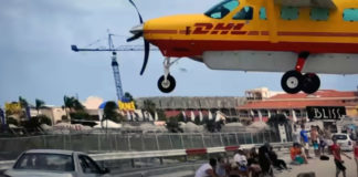 DHL Pilot Makes Some LOW Approaches Over Maho Beach.