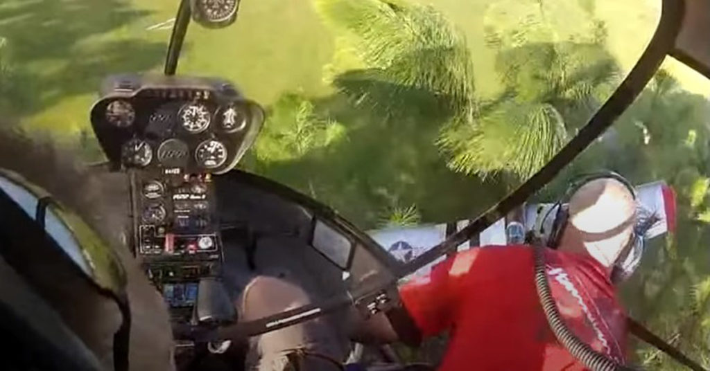 Fishing out a P-51 Mustang model airplane with a Robinson R-22