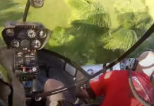 Kid Gets RC Plane Stuck In Tree, Guys In Helicopter Come To The Rescue Fishing out a P-51 Mustang model airplane with a Robinson R-22