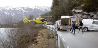 Helicopter Lands on Highway Guard Rail