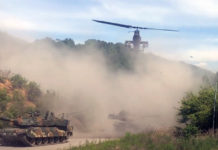 AH-1S Cobra Flying Over a Column of K2 Black Panthers