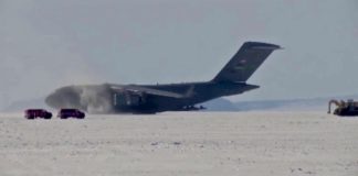 C-17 Globemaster III take off from deep snow runway at Phoenix Airfield, Antarctica