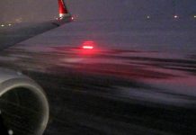 Boeing 737 Airplane Taking Off In Snowstorm Boeing 737 Airplane Taking Off In Snowstorm