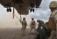Sling Loading An M777 On a CH-53E Super Stallion Helicopter Sling Loading An M777 On a CH-53E Super Stallion Helicopter