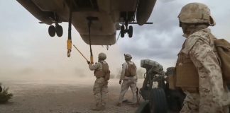 Sling Loading An M777 On a CH-53E Super Stallion Helicopter Sling Loading An M777 On a CH-53E Super Stallion Helicopter