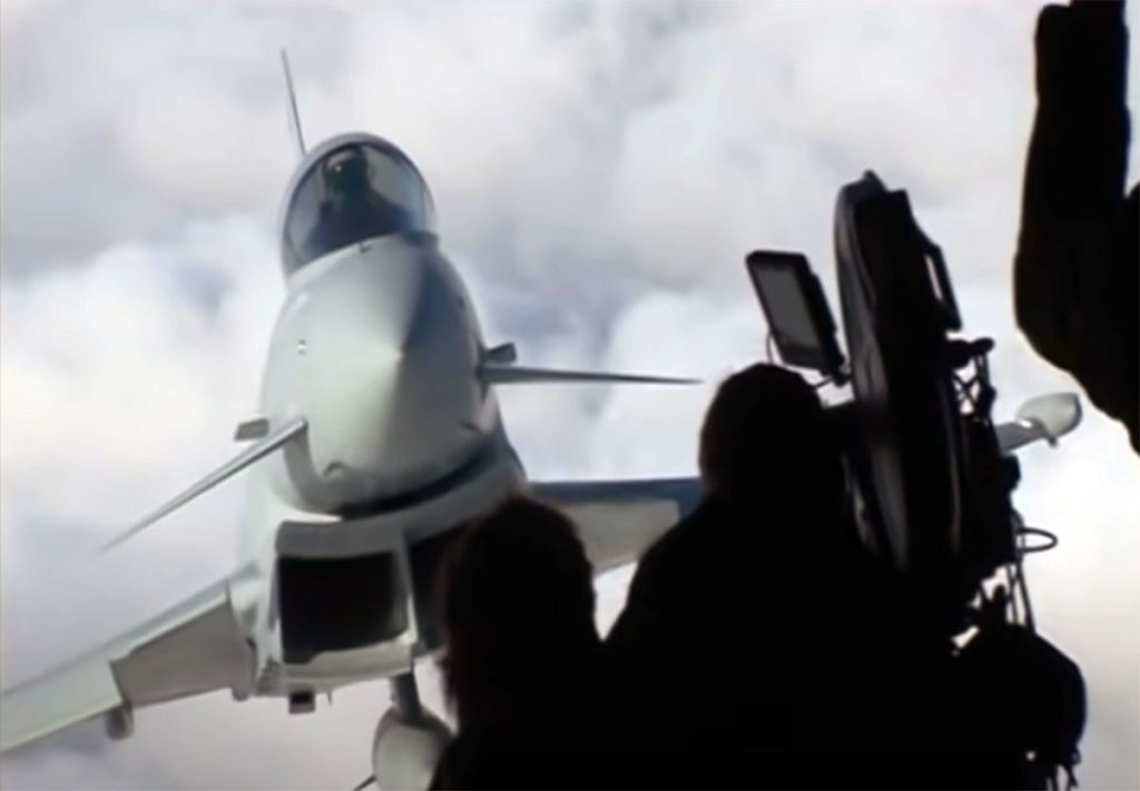 C-130 Hercules straining at full speed while the Typhoon are about to stall
